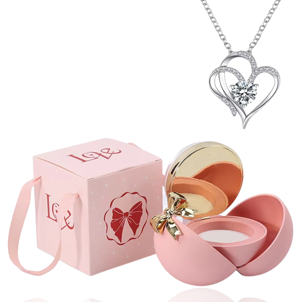 Boite à bijoux rose avec collier en forme de coeur argent