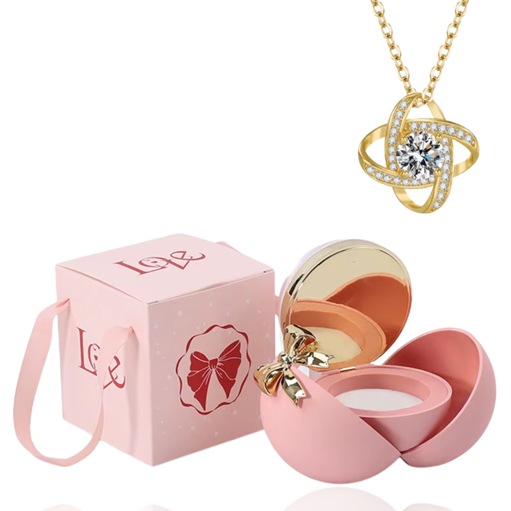 Boite à bijoux rose avec collier en or
