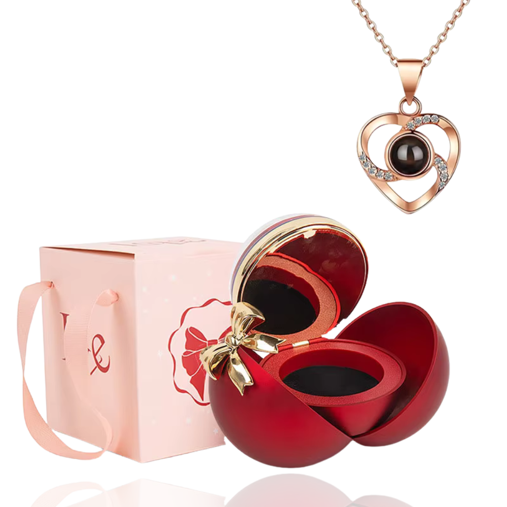 Boite à bijoux rouge avec collier en forme de coeur or rose
