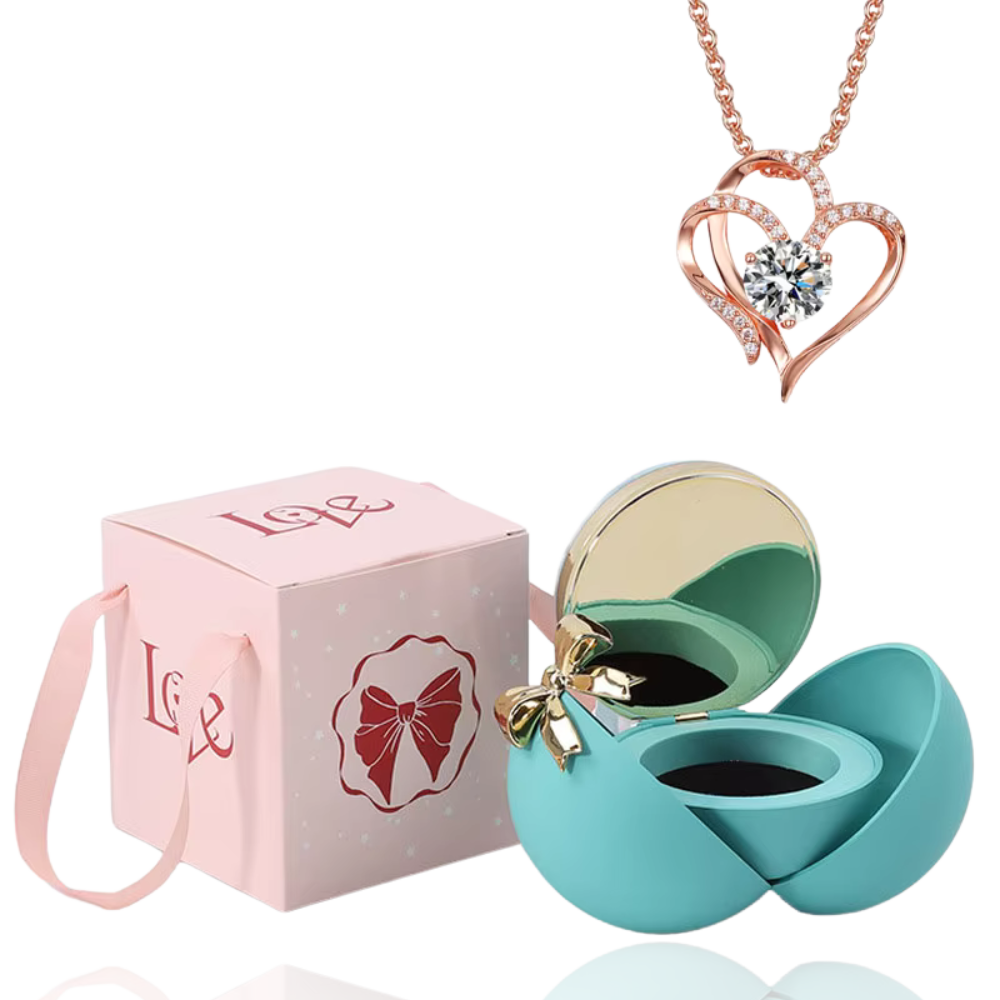 Boite à bijoux bleu avec collier en forme de coeur or rose
