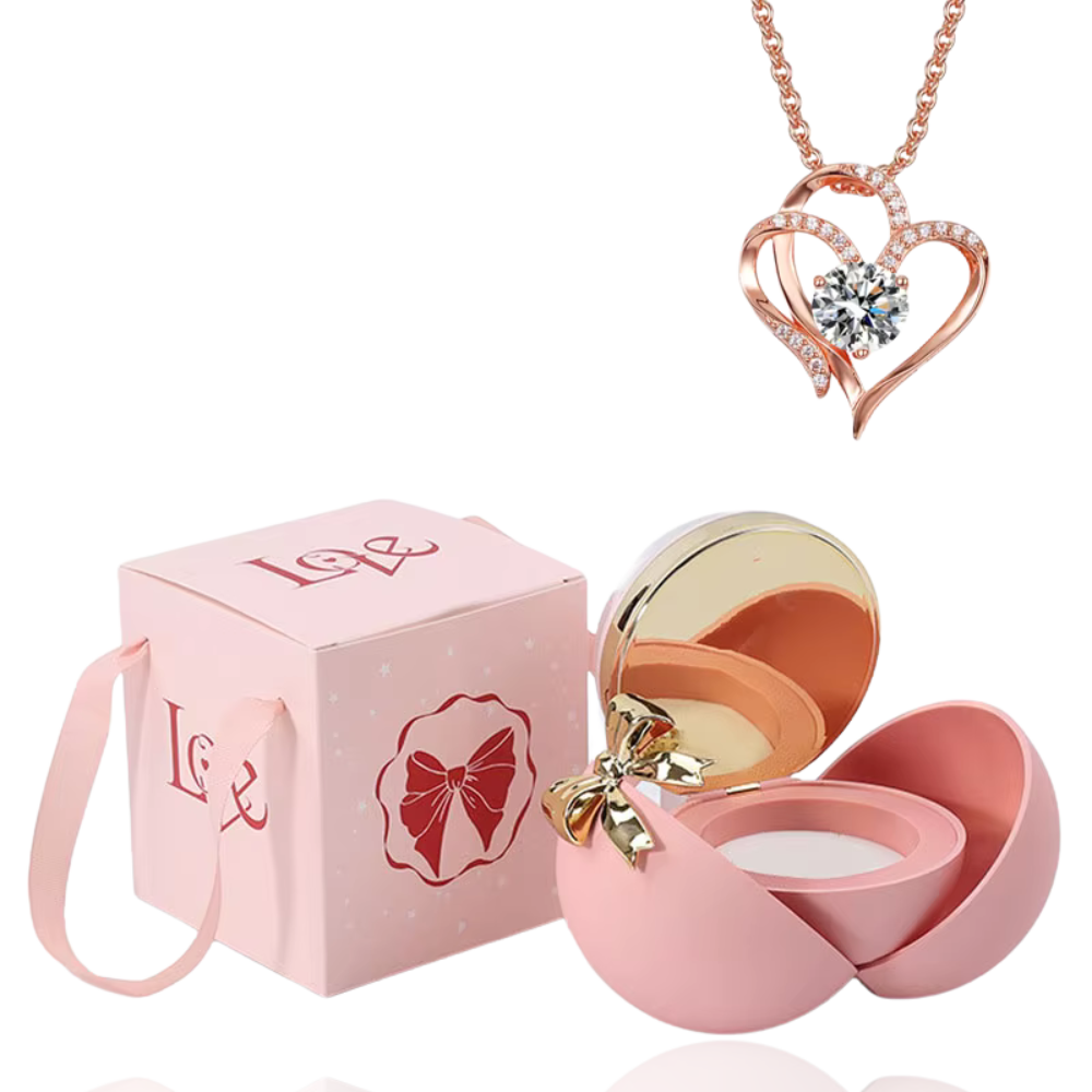 Boite à bijoux rose avec collier en forme de coeur or rose