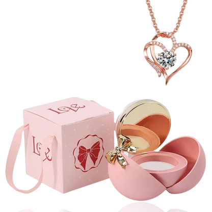 Boite à bijoux rose avec collier en forme de coeur or rose