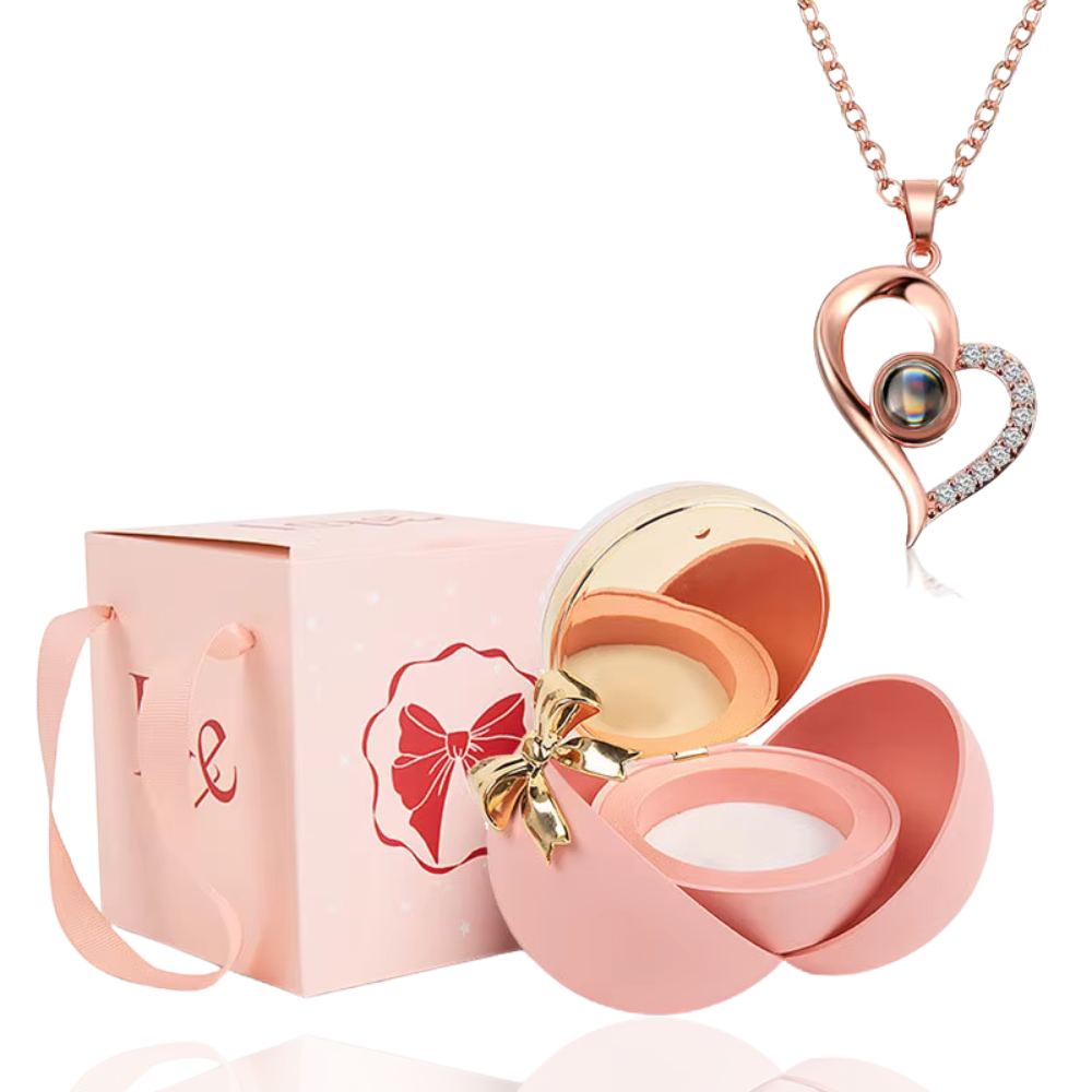 Boite à bijoux rose avec collier en forme de coeur or rose