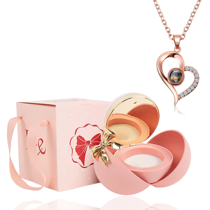 Boite à bijoux rose avec collier en forme de coeur or rose