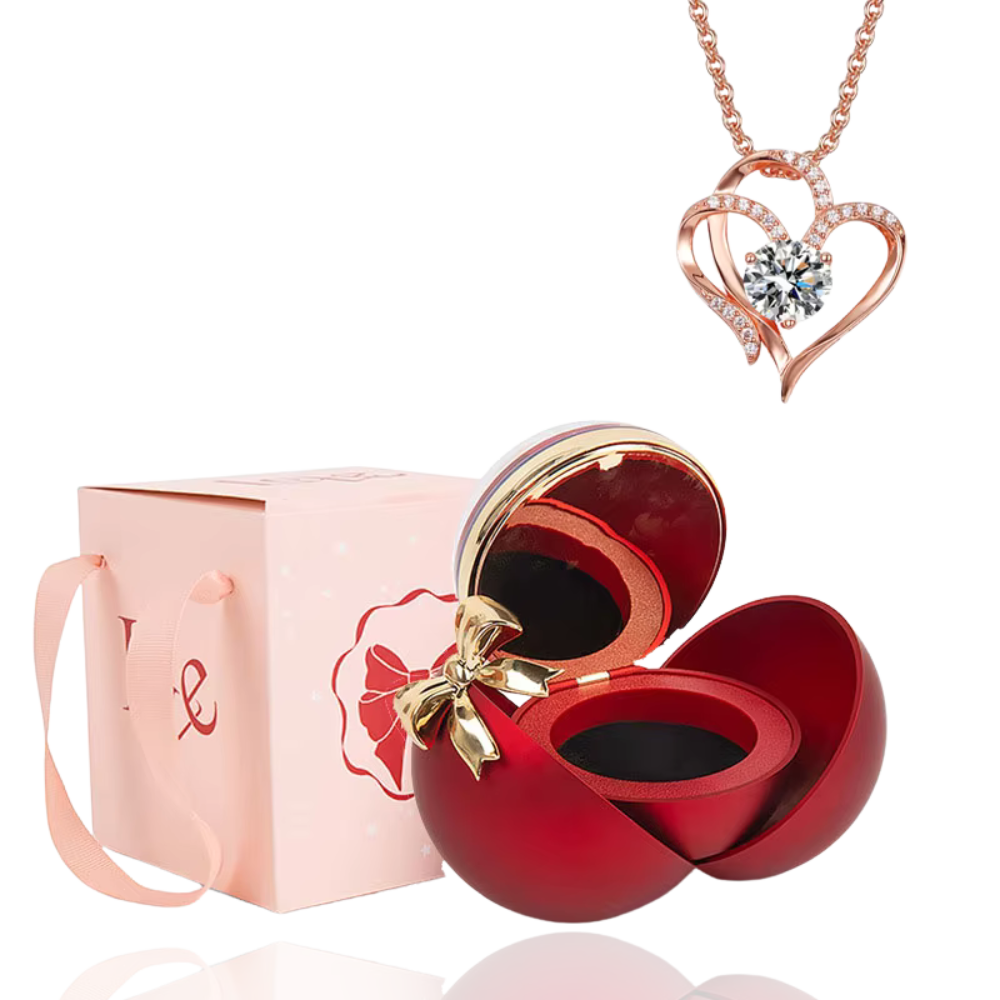 Boite à bijoux rouge avec collier en forme de coeur or rose