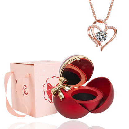 Boite à bijoux rouge avec collier en forme de coeur or rose