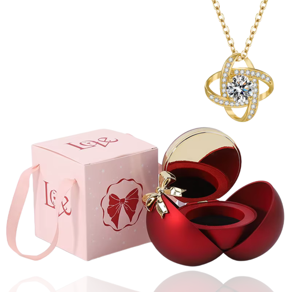 Boite à bijoux rouge avec collier en or