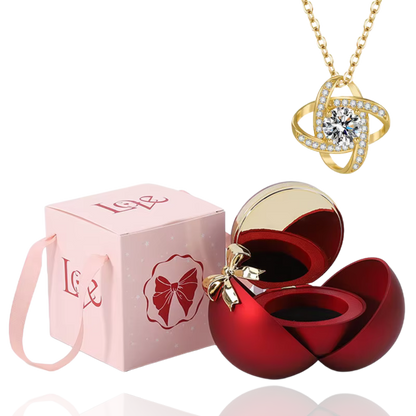 Boite à bijoux rouge avec collier en or