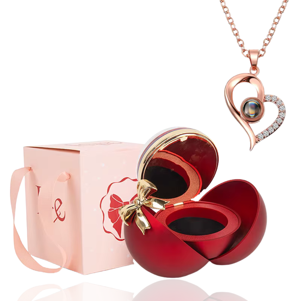 Boite à bijoux rouge avec collier en forme de coeur or rose