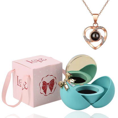 Boite à bijoux bleu avec collier en forme de coeur or rose